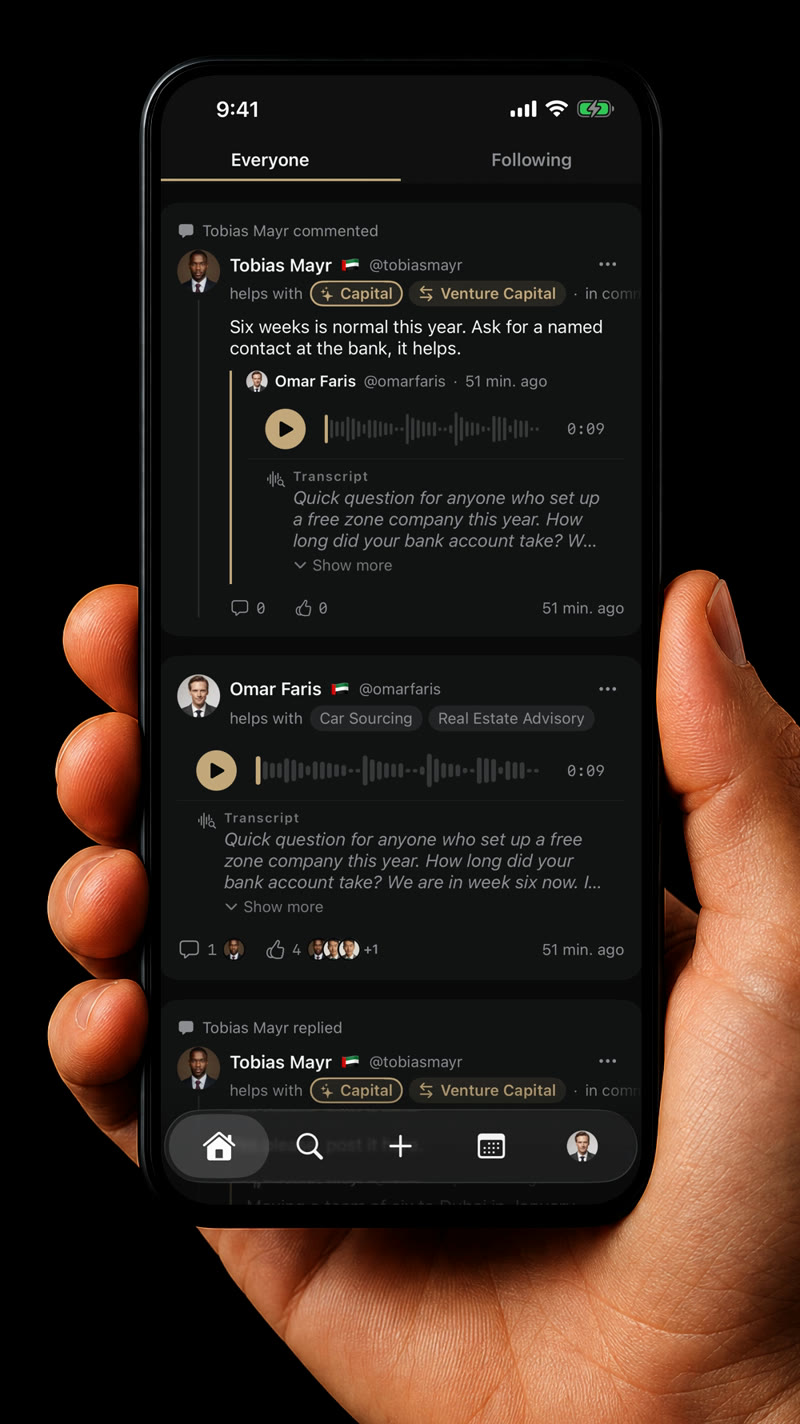 A hand holding an iPhone with the Tizzal feed: posts and voice messages with transcripts from members in Dubai.